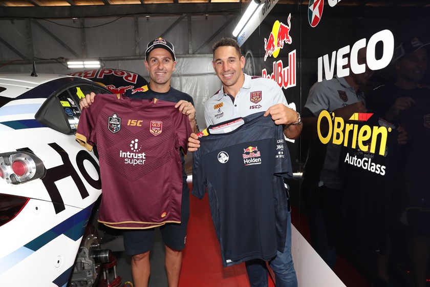 Jamie Whincup and Billy Slater swap shirts in Melbourne.