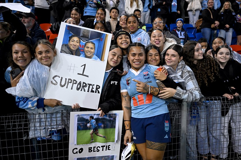 NSW Blues forward Sarah Togatuki with family members at fulltime after playing in honour of sister in Origin III at McDonald Jones Stadium.